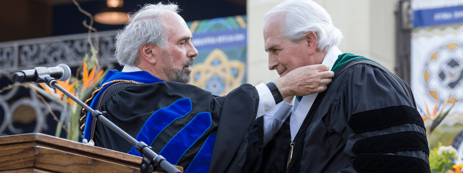 Dr. Powell receiving award from Dr. Bailey.